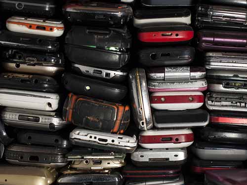 stack of old cell phones
