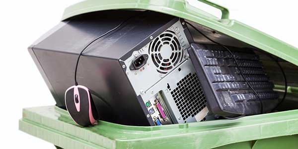 recycling bin with old computer